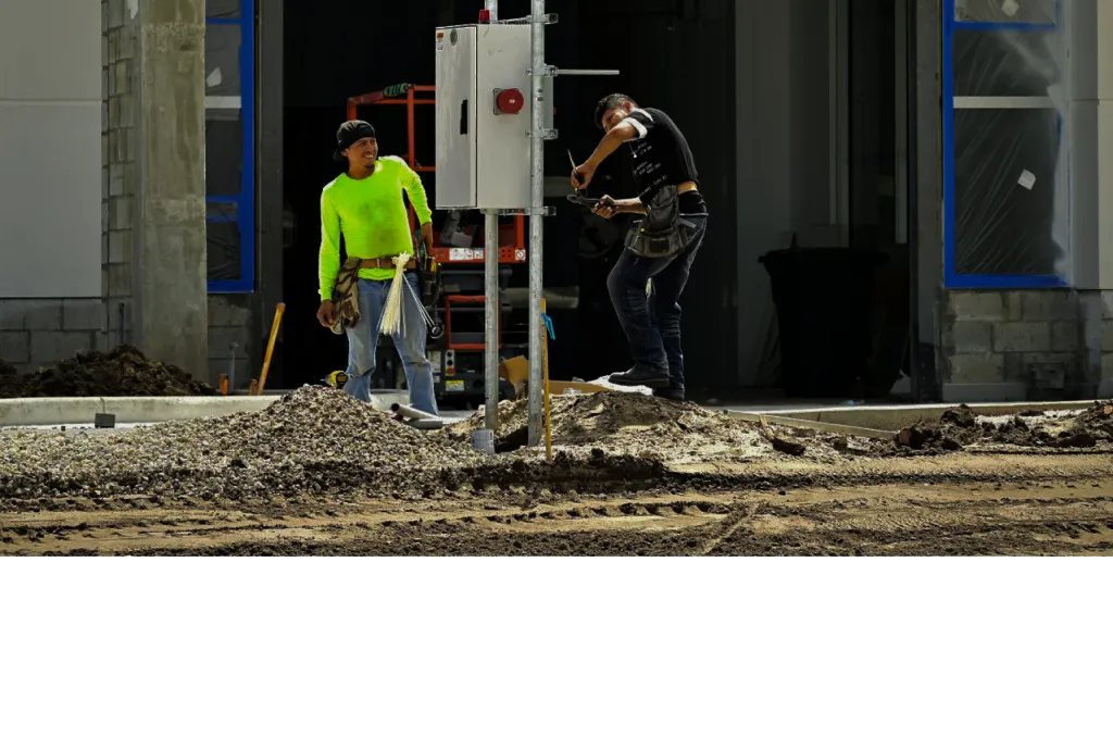 Electrician working on commercial lighting installation
